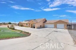 a view of spacious house with a big yard