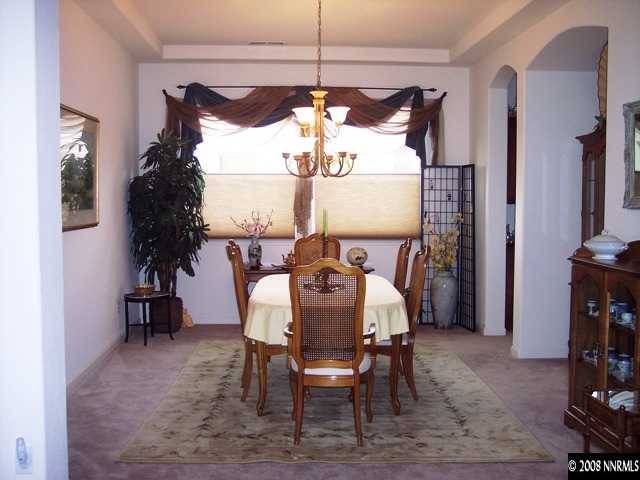1687 Gemtown Drive Reno, NV 89521 - Photo 4 of 9 a view of a dining room with furniture and window
