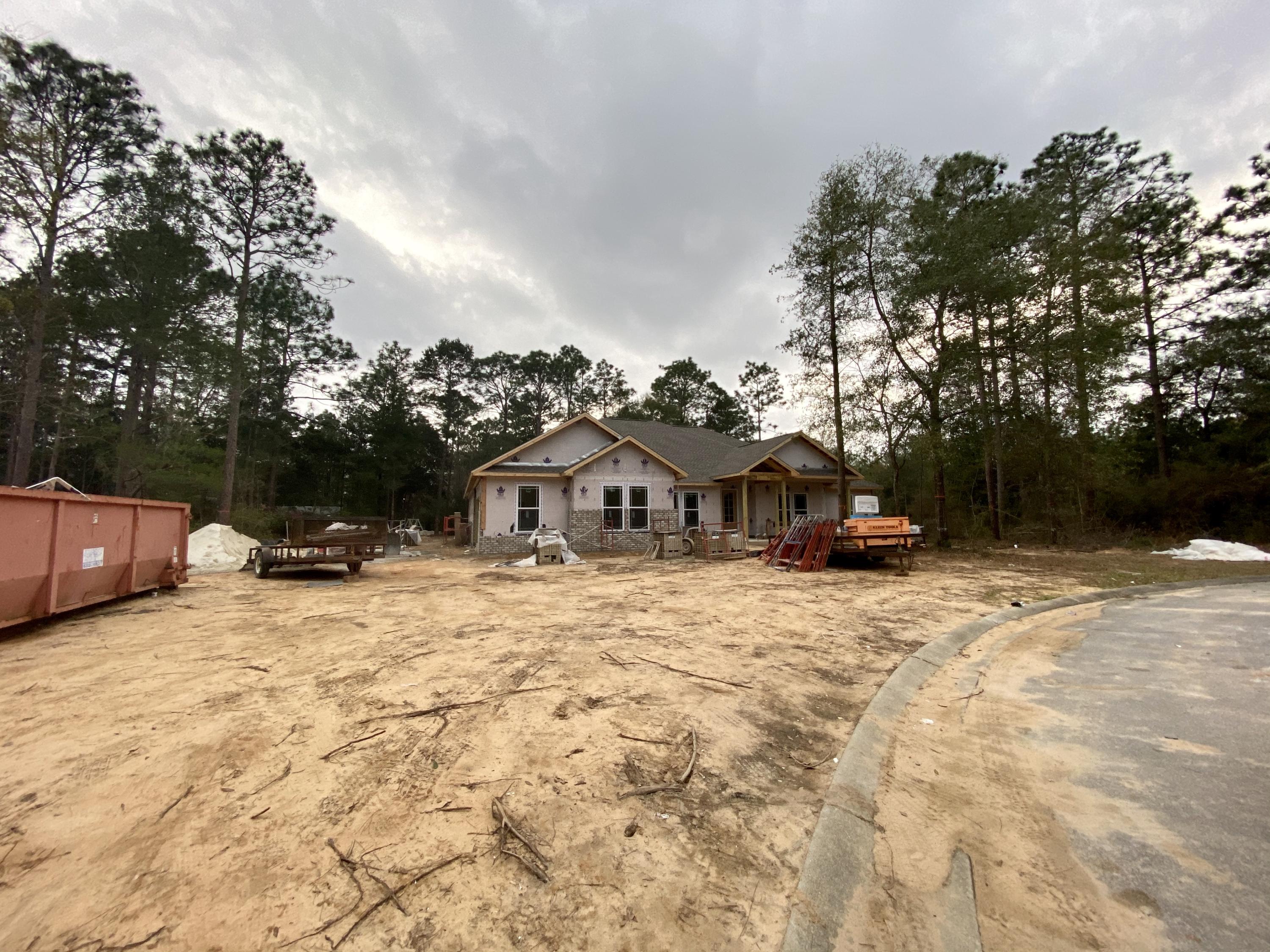 6080 Carina Road Crestview, FL 32539 - Photo 8 of 14 a view of house with yard covered in snow