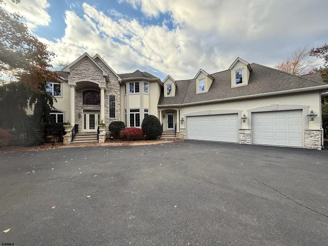 a front view of residential houses with yard