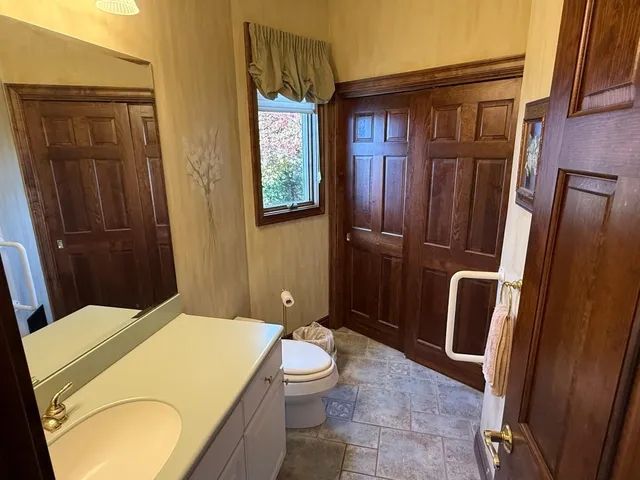 a bedroom with bed and window