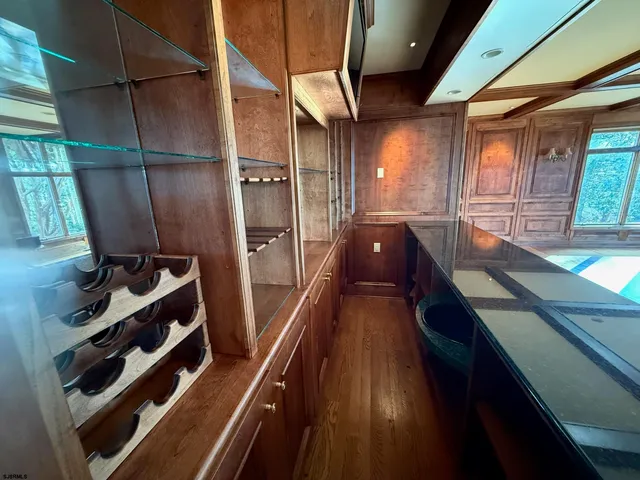 a bedroom with a bed chair and a window