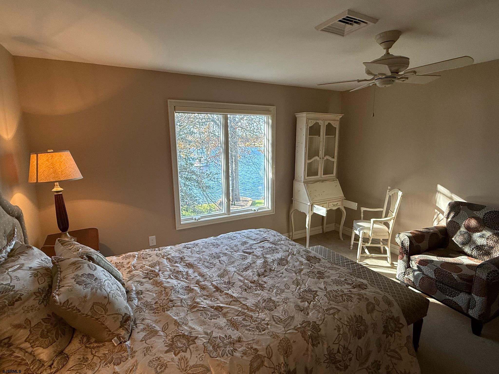 225 Old River Road Mays Landing, NJ 08330 - Photo 65 of 97 a bedroom with a bed and wooden floor