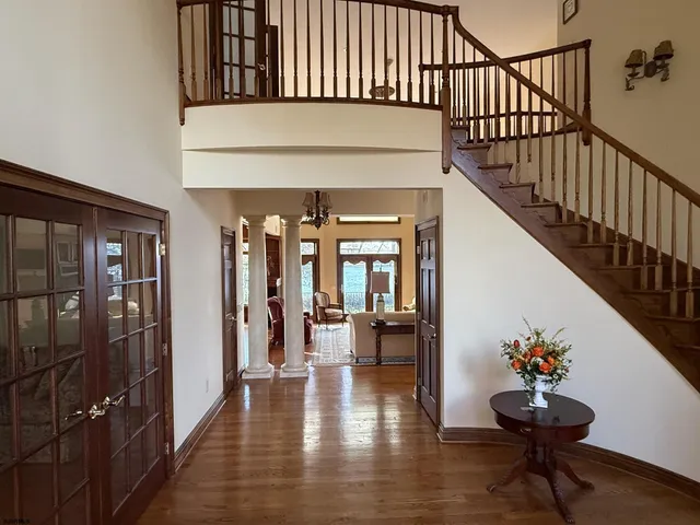 a view of a dining room with furniture and chandelier