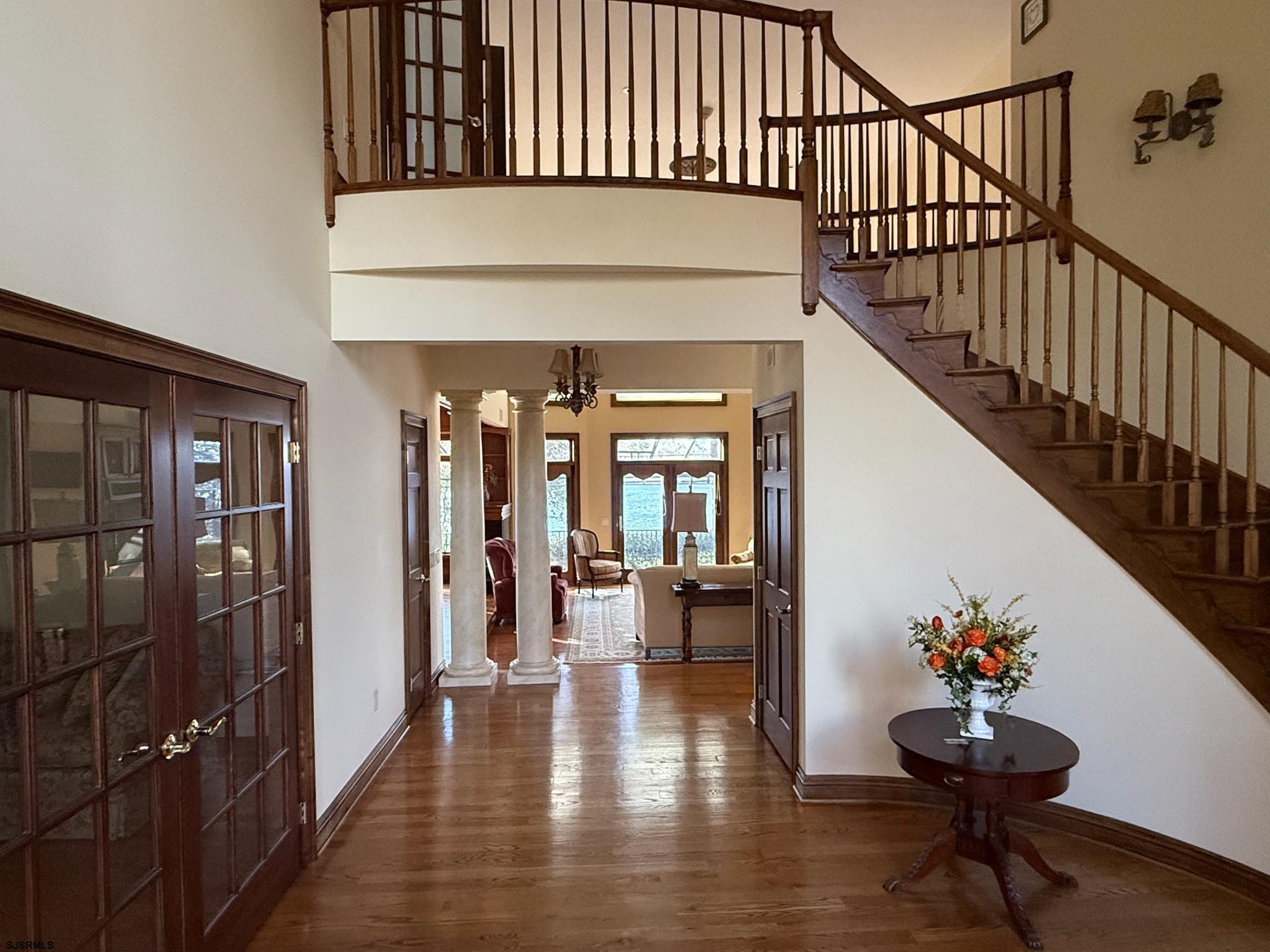 225 Old River Road Mays Landing, NJ 08330 - Photo 7 of 97 a view of staircase with lots of frames on wall and a window