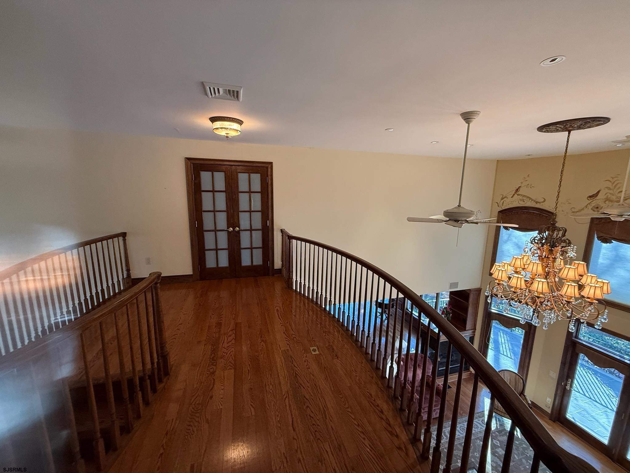 225 Old River Road Mays Landing, NJ 08330 - Photo 73 of 97 a view of an entryway wooden floor and chandelier