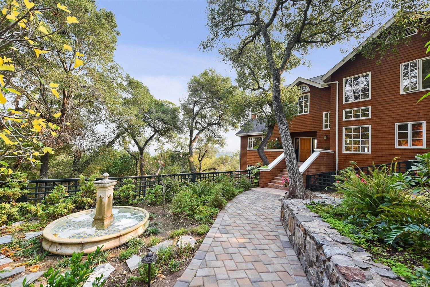 51 Ridge Road Fairfax, CA 94930 - Photo 1 of 1 a backyard of a house with a fountain table and chairs