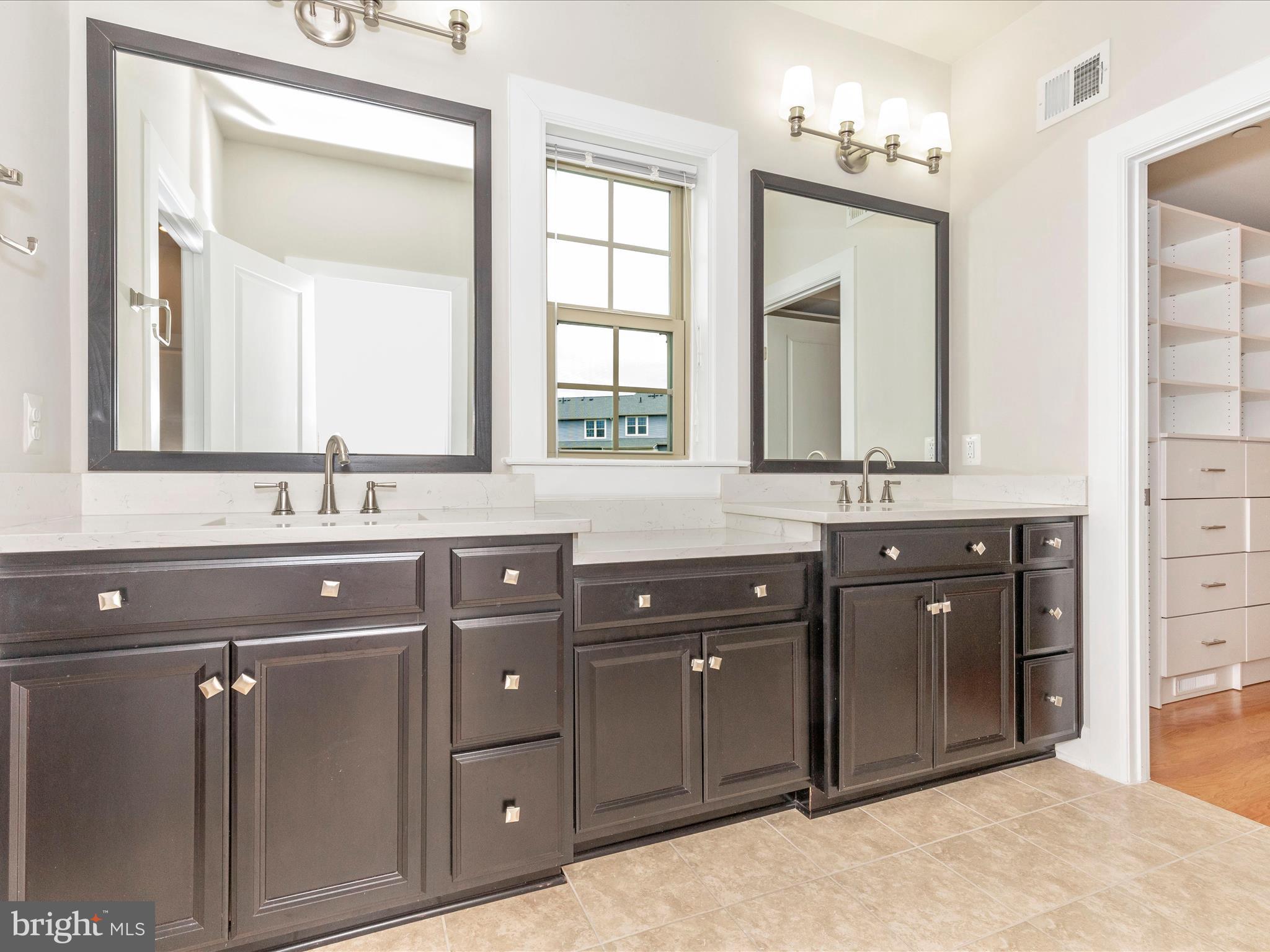 3838 Fulham Road Frederick, MD 21704 - Photo 18 of 51 a bathroom with a double vanity sink and mirror