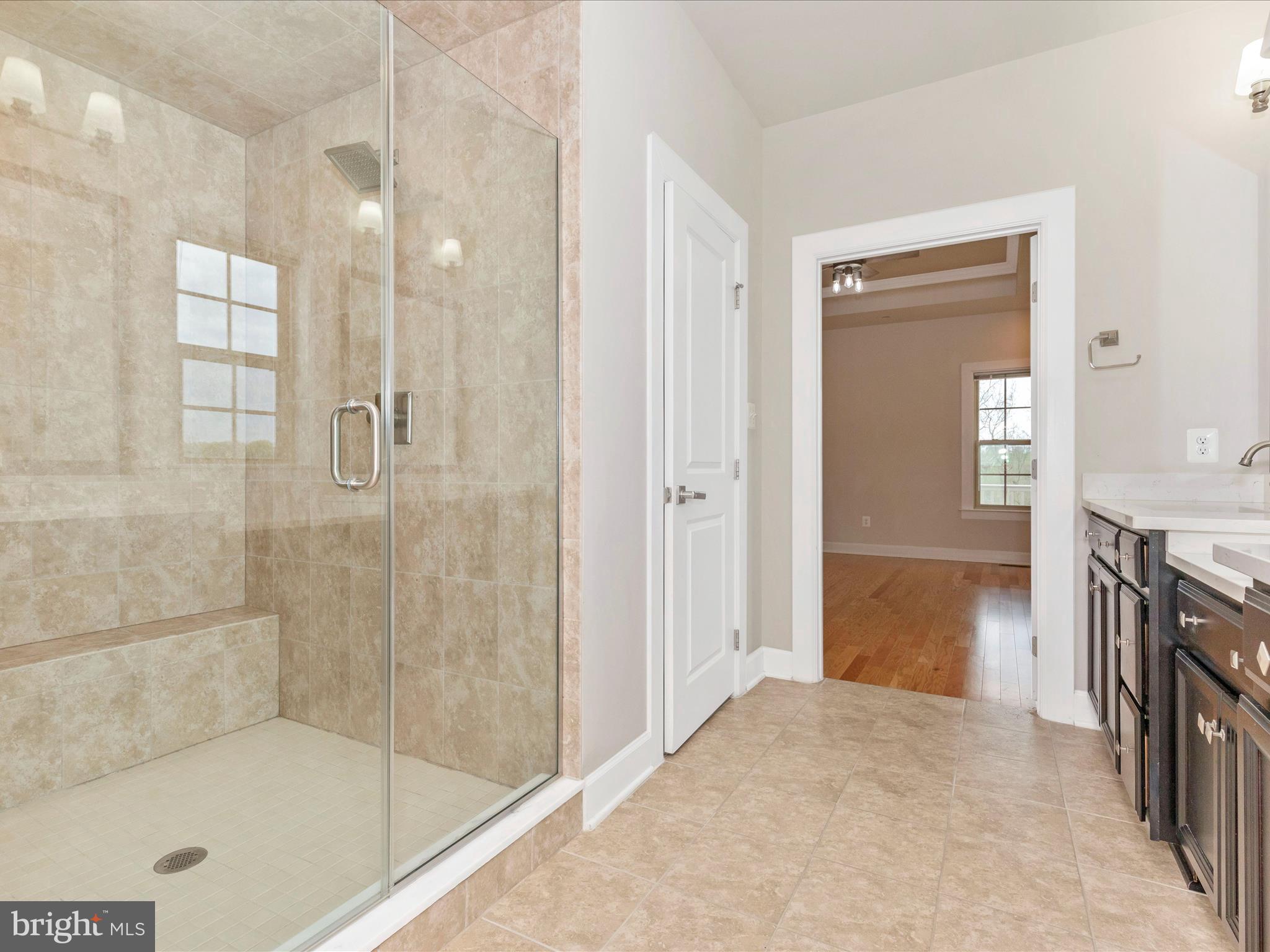 3838 Fulham Road Frederick, MD 21704 - Photo 19 of 51 a bathroom with a tub shower and mirror
