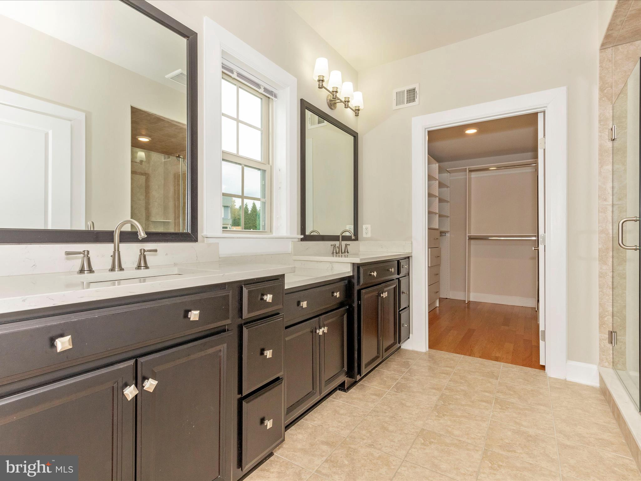 3838 Fulham Road Frederick, MD 21704 - Photo 20 of 51 a spacious bathroom with a granite countertop sink mirror and a