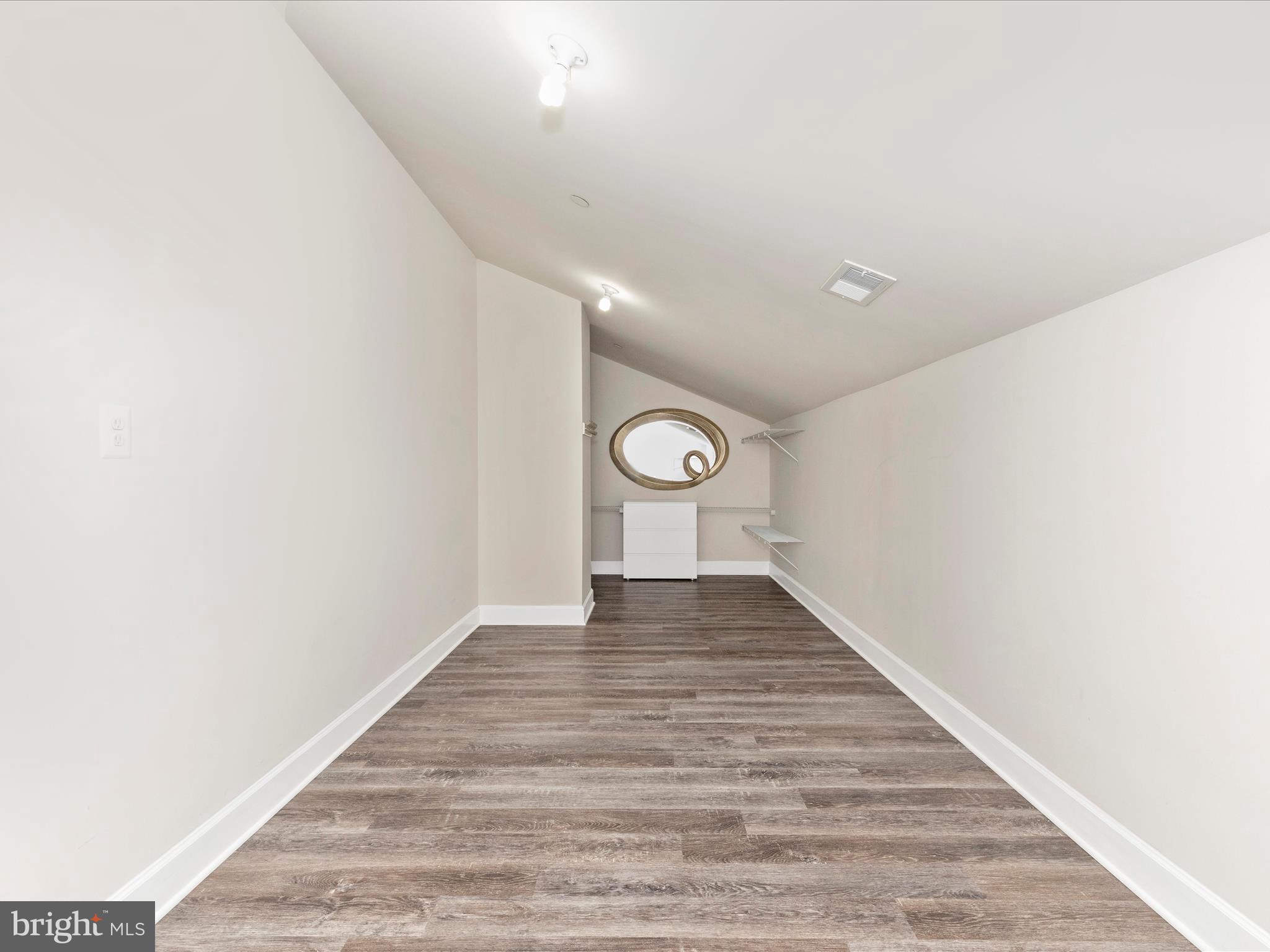 3838 Fulham Road Frederick, MD 21704 - Photo 22 of 51 a view of a hallway with wooden floor