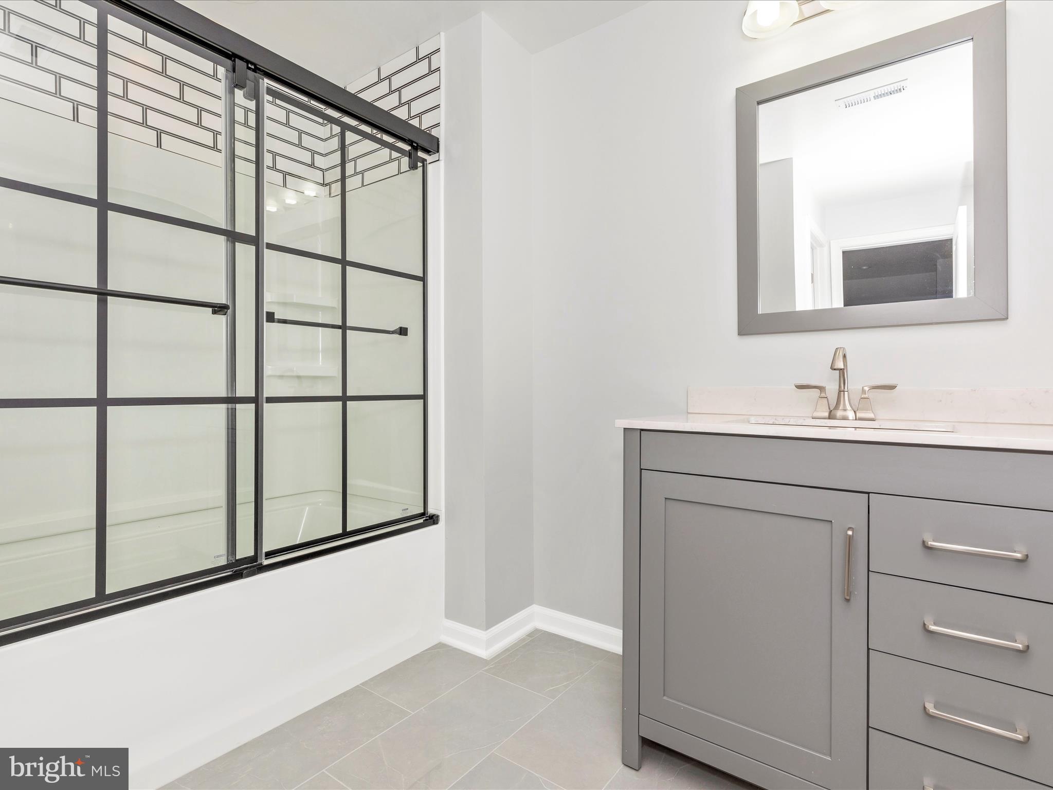 3838 Fulham Road Frederick, MD 21704 - Photo 29 of 51 a bathroom with a sink a mirror and a window