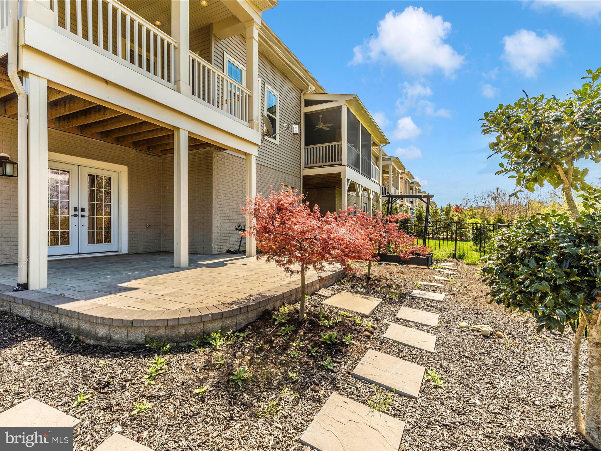3838 Fulham Road Frederick, MD 21704 - Photo 33 of 51 a view of a white house with a yard and table and chairs