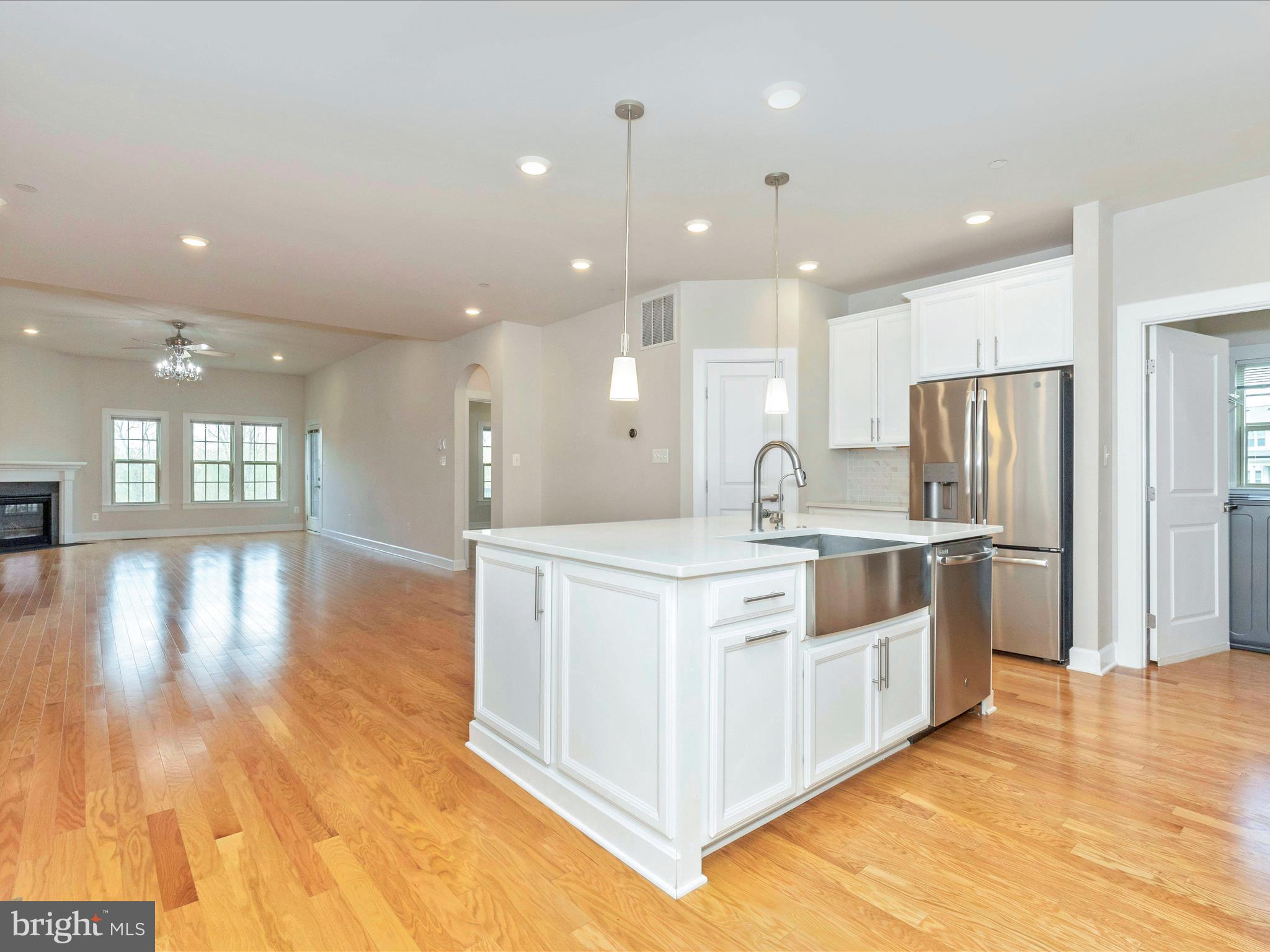 3838 Fulham Road Frederick, MD 21704 - Photo 4 of 51 a large white kitchen with stainless steel appliances granite countertop a large center island and a sink