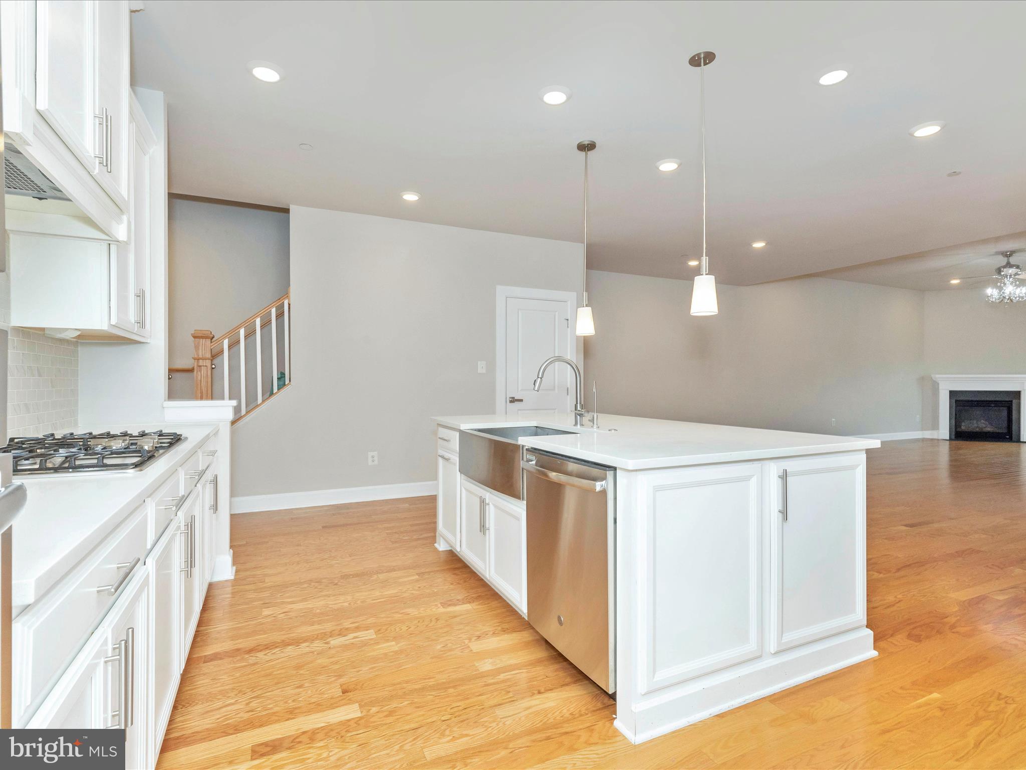 3838 Fulham Road Frederick, MD 21704 - Photo 7 of 51 a large white kitchen with stainless steel appliances granite countertop a stove and a sink