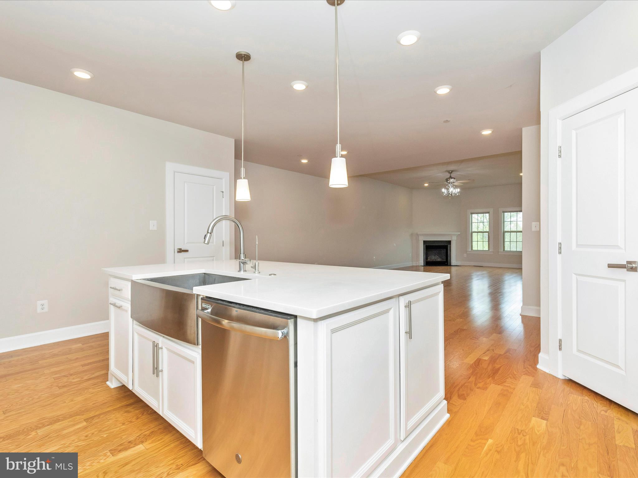 3838 Fulham Road Frederick, MD 21704 - Photo 9 of 51 a kitchen with a stove a sink a refrigerator and chairs