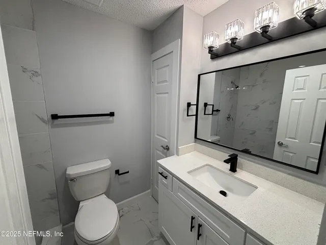 a bathroom with a sink and a toilet