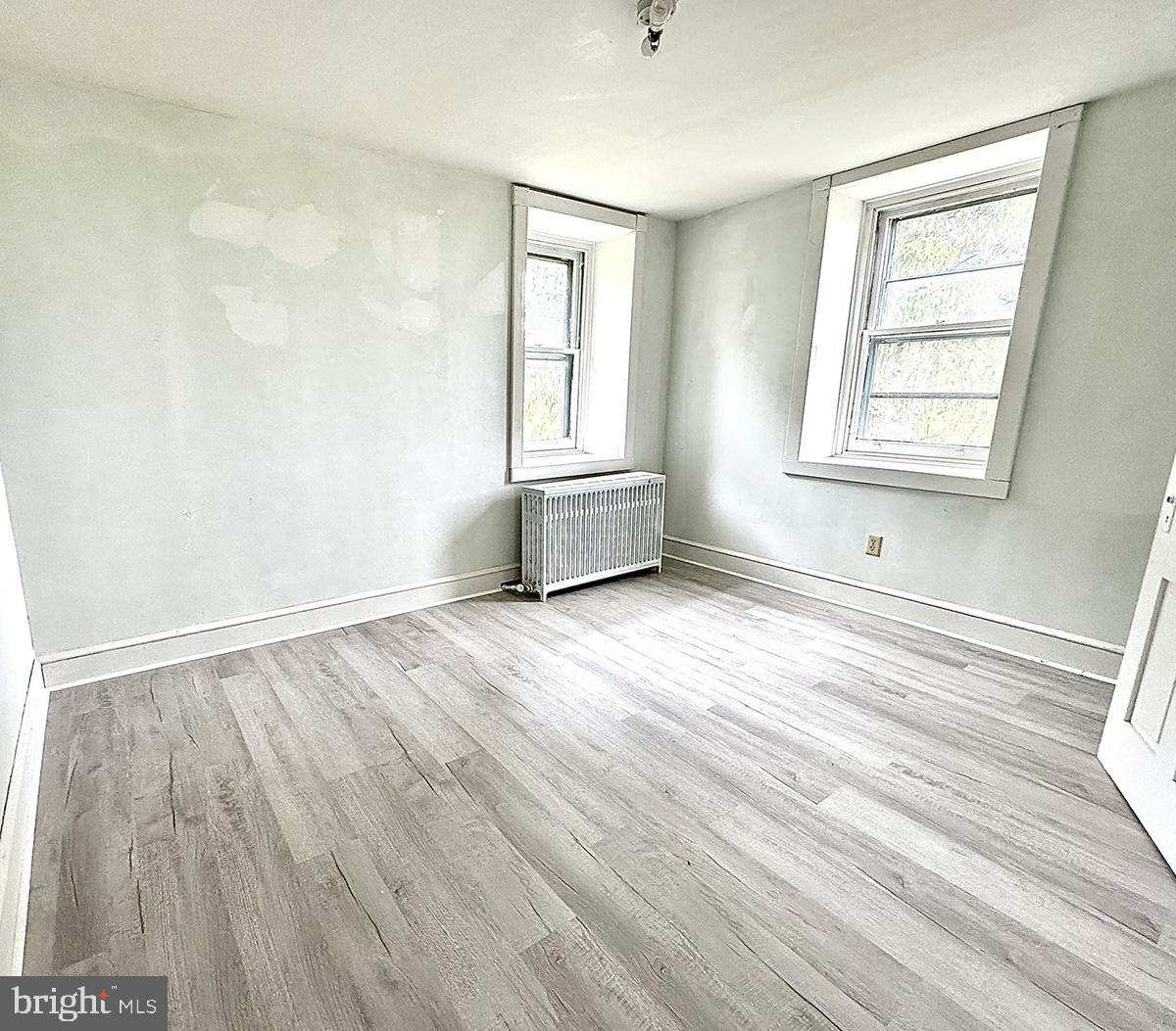 133 Hunter Road Oley, PA 19547 - Photo 20 of 44 a view of an empty room with wooden floor and a window