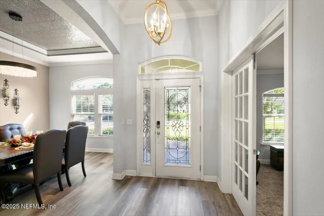 a view of dining room with furniture and wooden floor