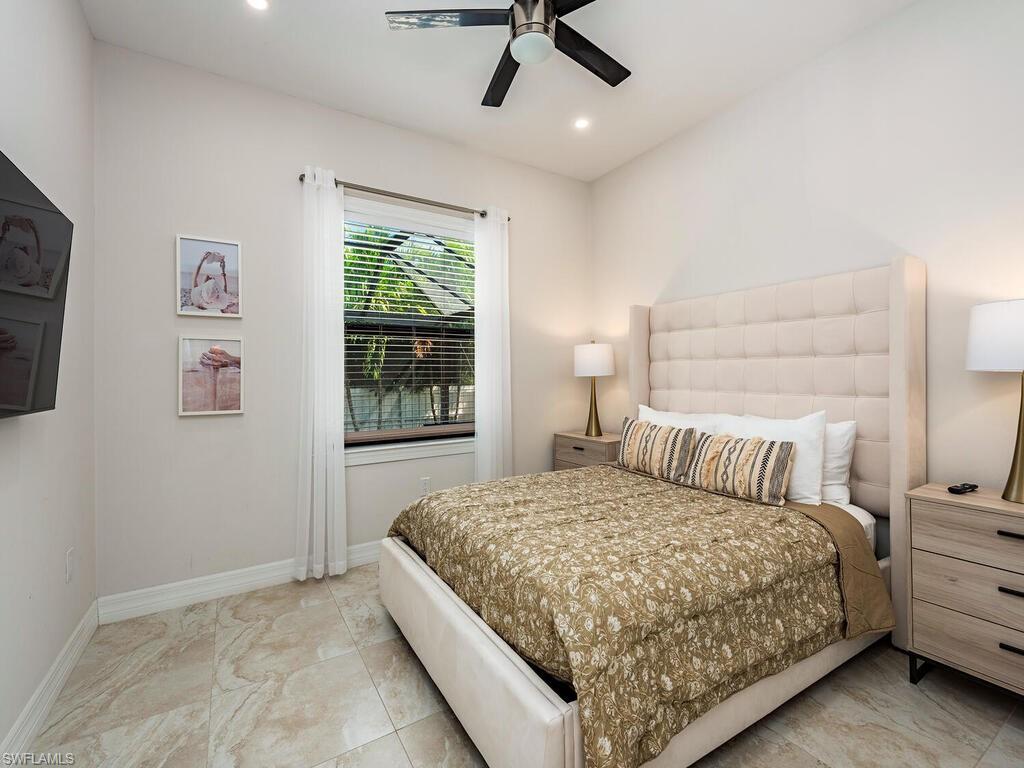 1021 Creech Road Naples, FL 34103 - Photo 8 of 12 Bedroom with recessed lighting and a ceiling fan