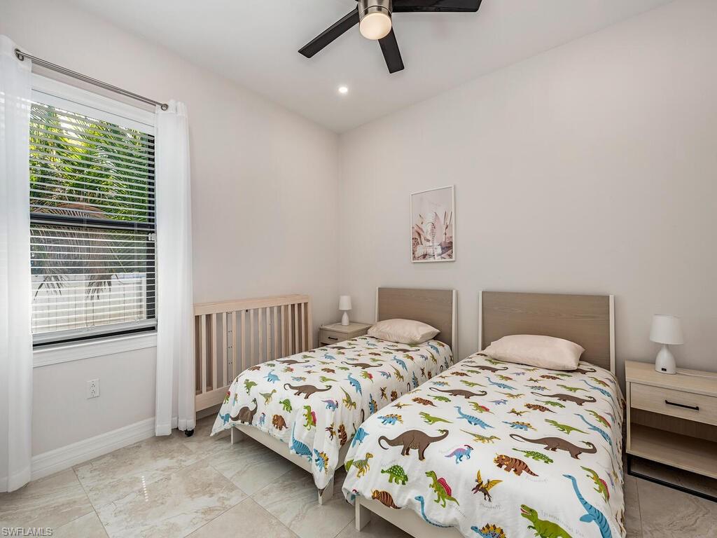 1021 Creech Road Naples, FL 34103 - Photo 10 of 12 Bedroom with a ceiling fan and recessed lighting