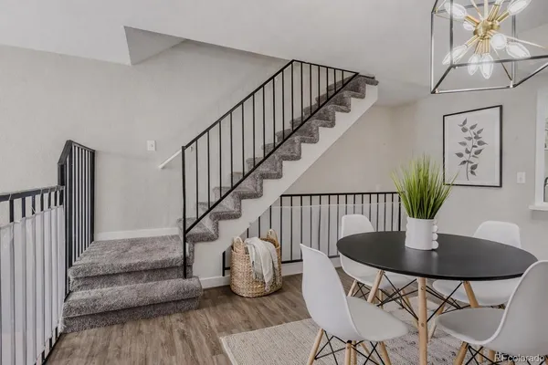 a view of a dining room with furniture wooden floor and dining table