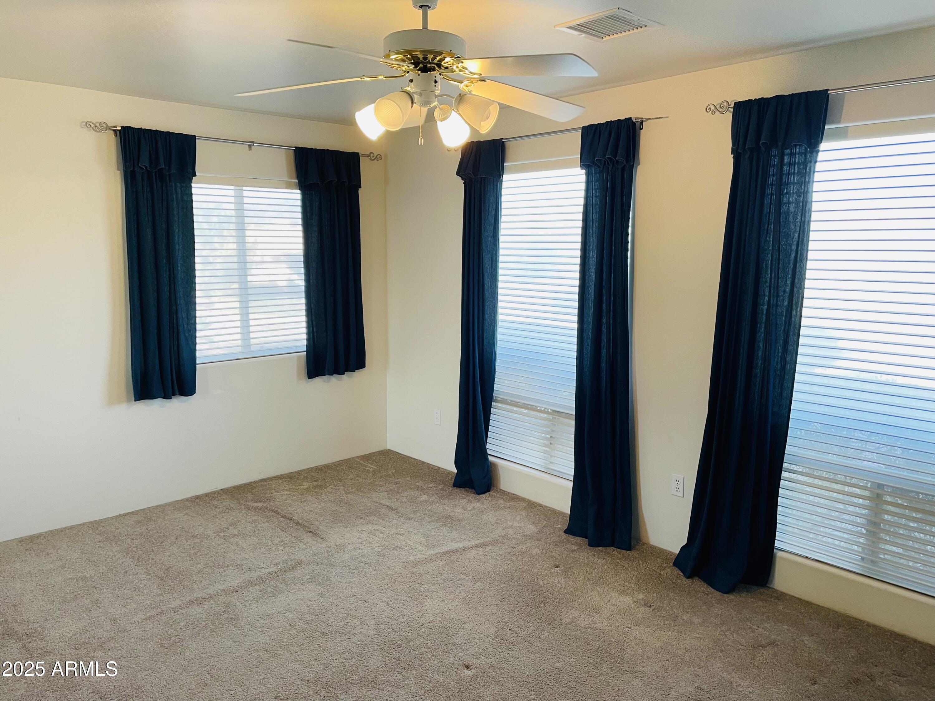 80 Stone Way Sedona, AZ 86351 - Photo 13 of 20 an empty room with windows and fan