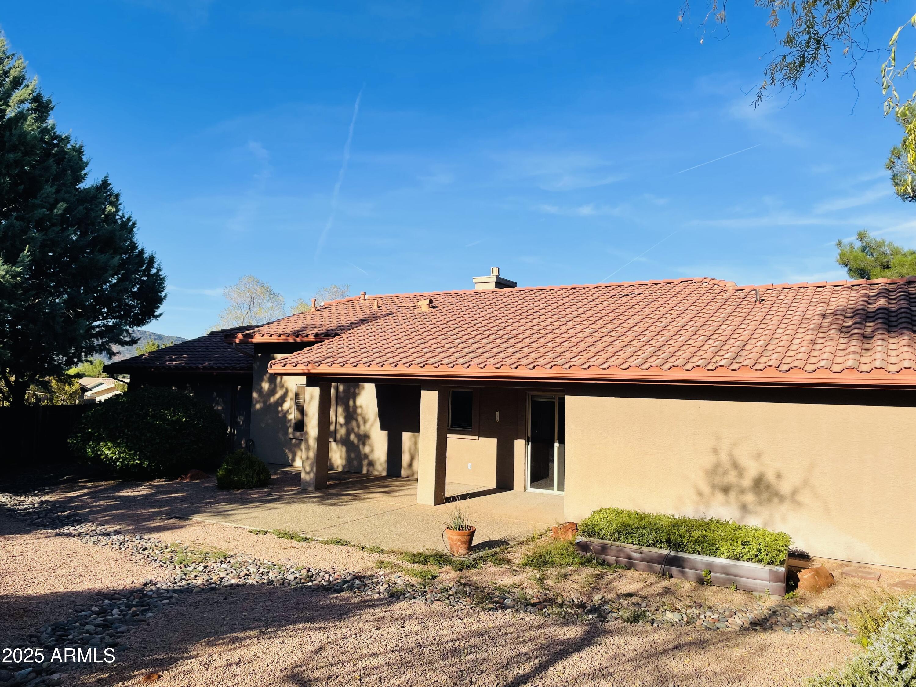 80 Stone Way Sedona, AZ 86351 - Photo 20 of 20 a front view of a house with a yard