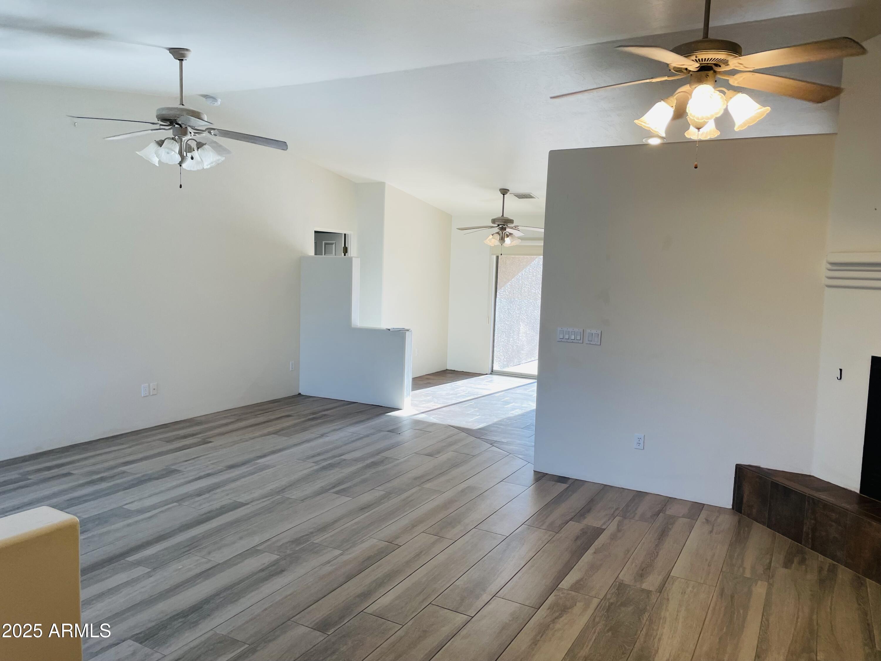 80 Stone Way Sedona, AZ 86351 - Photo 7 of 20 a view of empty room with wooden floor and fan