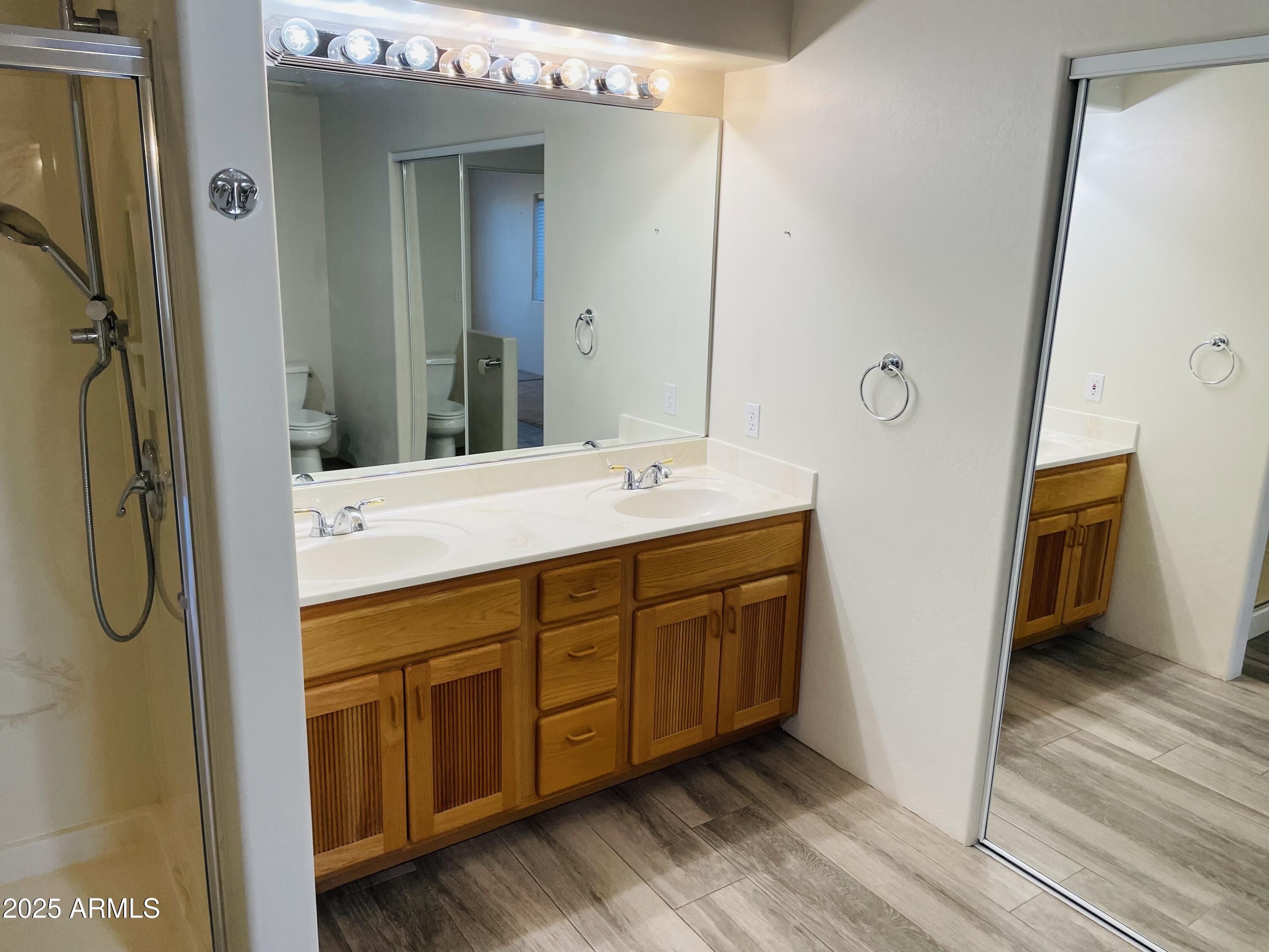 80 Stone Way Sedona, AZ 86351 - Photo 10 of 20 a bathroom with a double vanity sink a mirror and shower