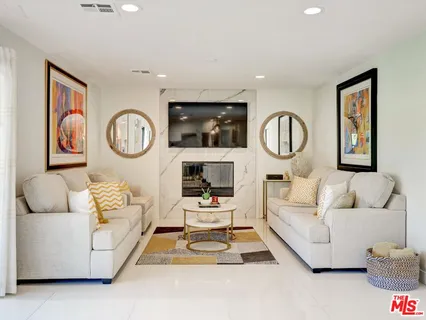 a living room with furniture and white walls