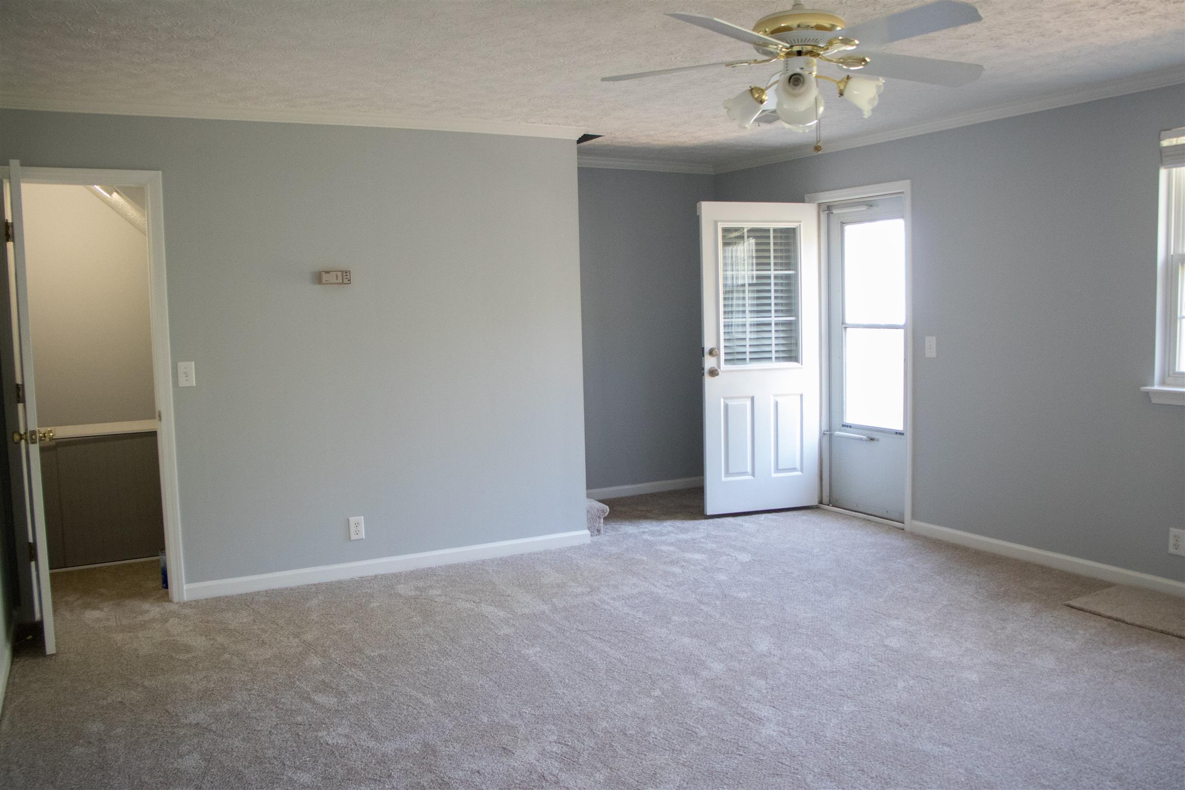 2962 Baby Ruth Lane, Unit 12 Antioch, TN 37013 - Photo 4 of 7 A view of living room with under stairs storage closet and door to patio