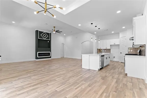 a view of kitchen with cabinets and wooden floor