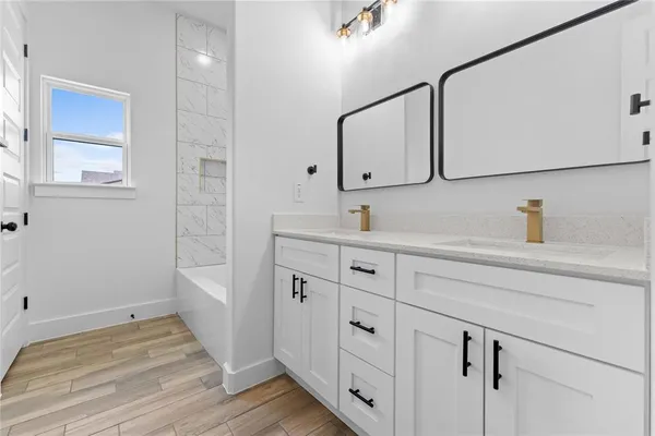 a bathroom with a sink and a mirror