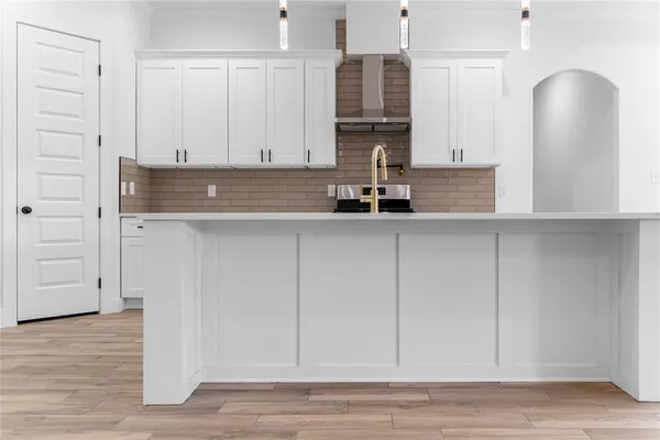 a kitchen with stainless steel appliances granite countertop a sink and cabinets