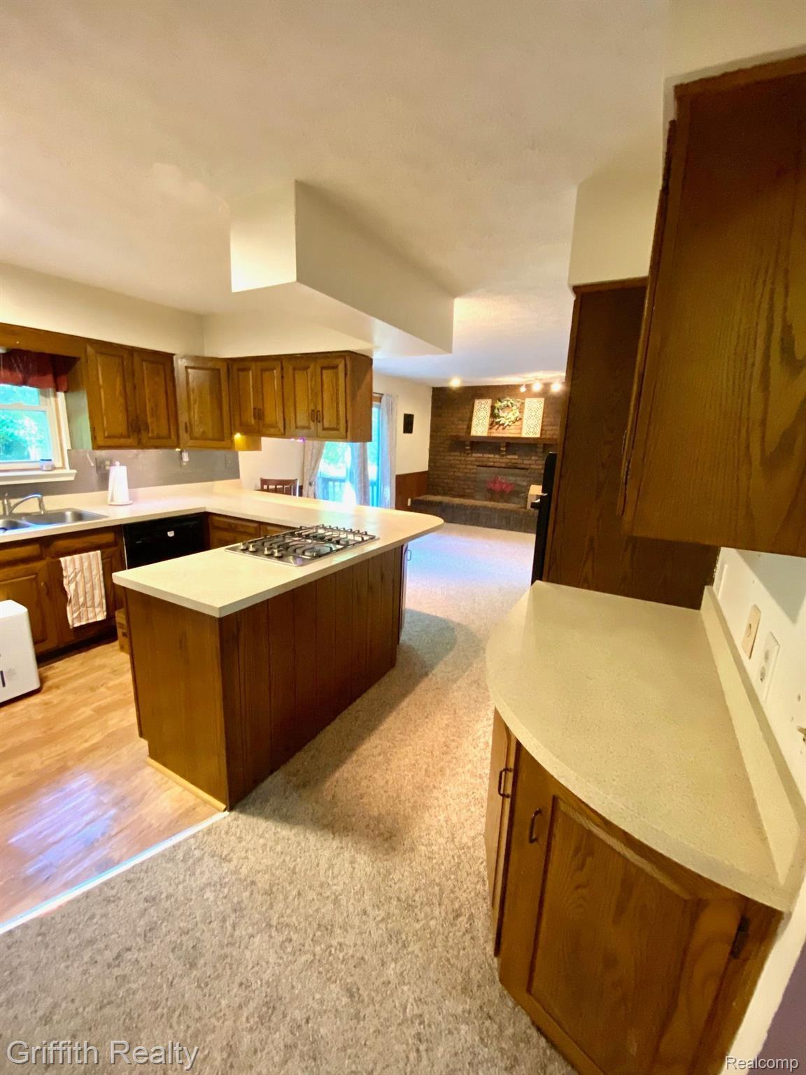 5761 Warner Road Fowlerville, MI 48836 - Photo 12 of 63 Kitchen w fireplace view