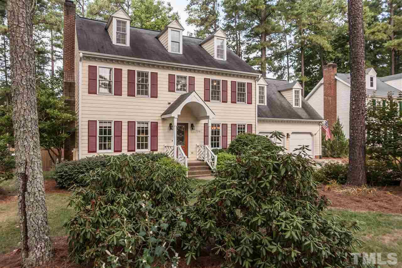 7205 Sawbuck Court Raleigh, NC 27613 - Photo 1 of 25 a front view of a house with a garden