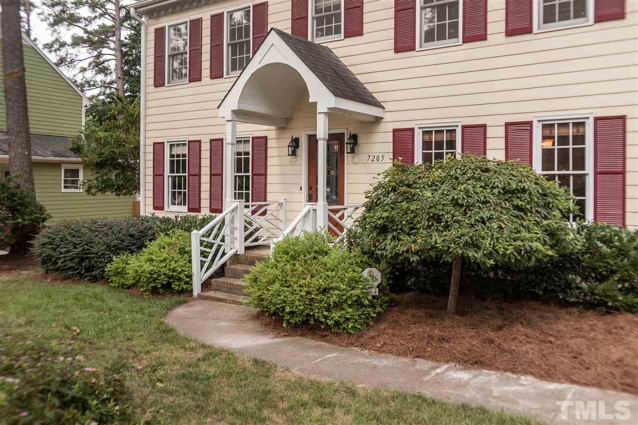 7205 Sawbuck Court Raleigh, NC 27613 - Photo 2 of 25 front view of a house with a yard