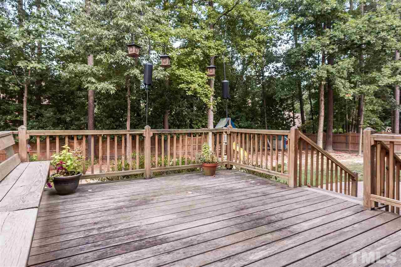 7205 Sawbuck Court Raleigh, NC 27613 - Photo 23 of 25 a view of deck with wooden floor and fence