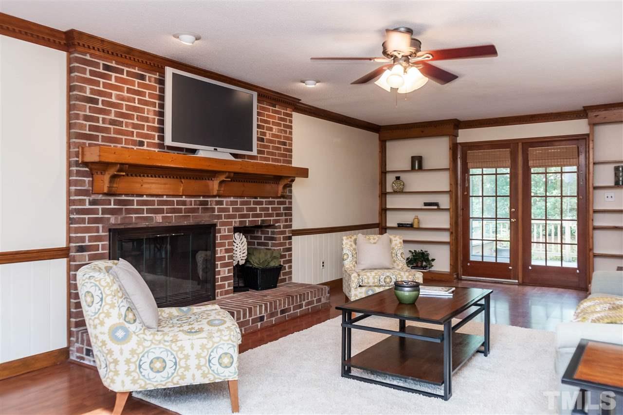 7205 Sawbuck Court Raleigh, NC 27613 - Photo 4 of 25 a living room with furniture and a fireplace