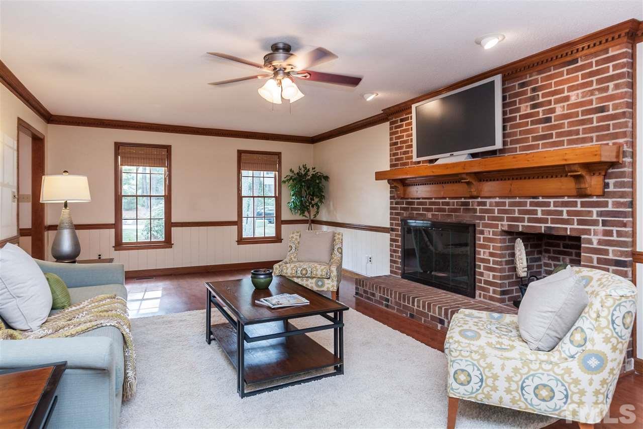 7205 Sawbuck Court Raleigh, NC 27613 - Photo 5 of 25 a living room with furniture and a fireplace