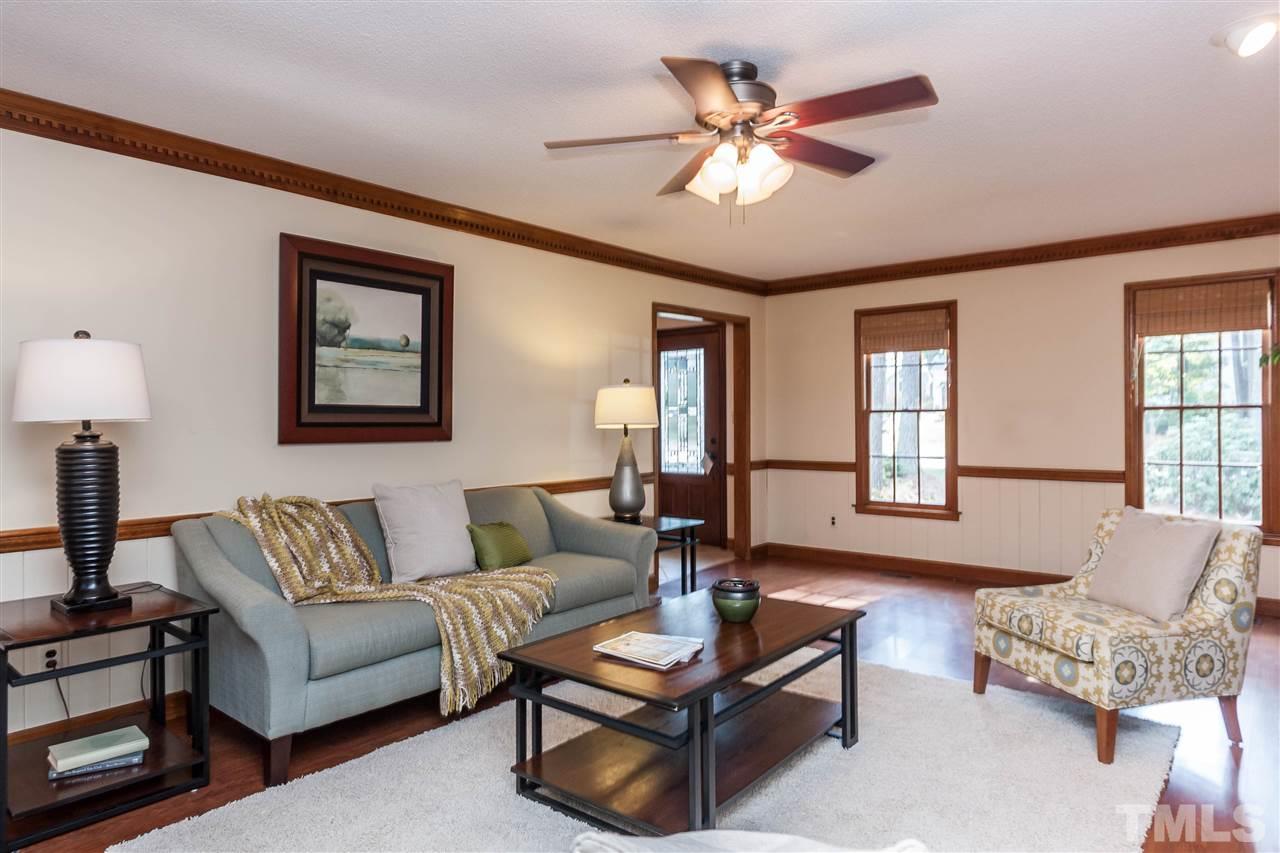 7205 Sawbuck Court Raleigh, NC 27613 - Photo 7 of 25 a living room with furniture and a window