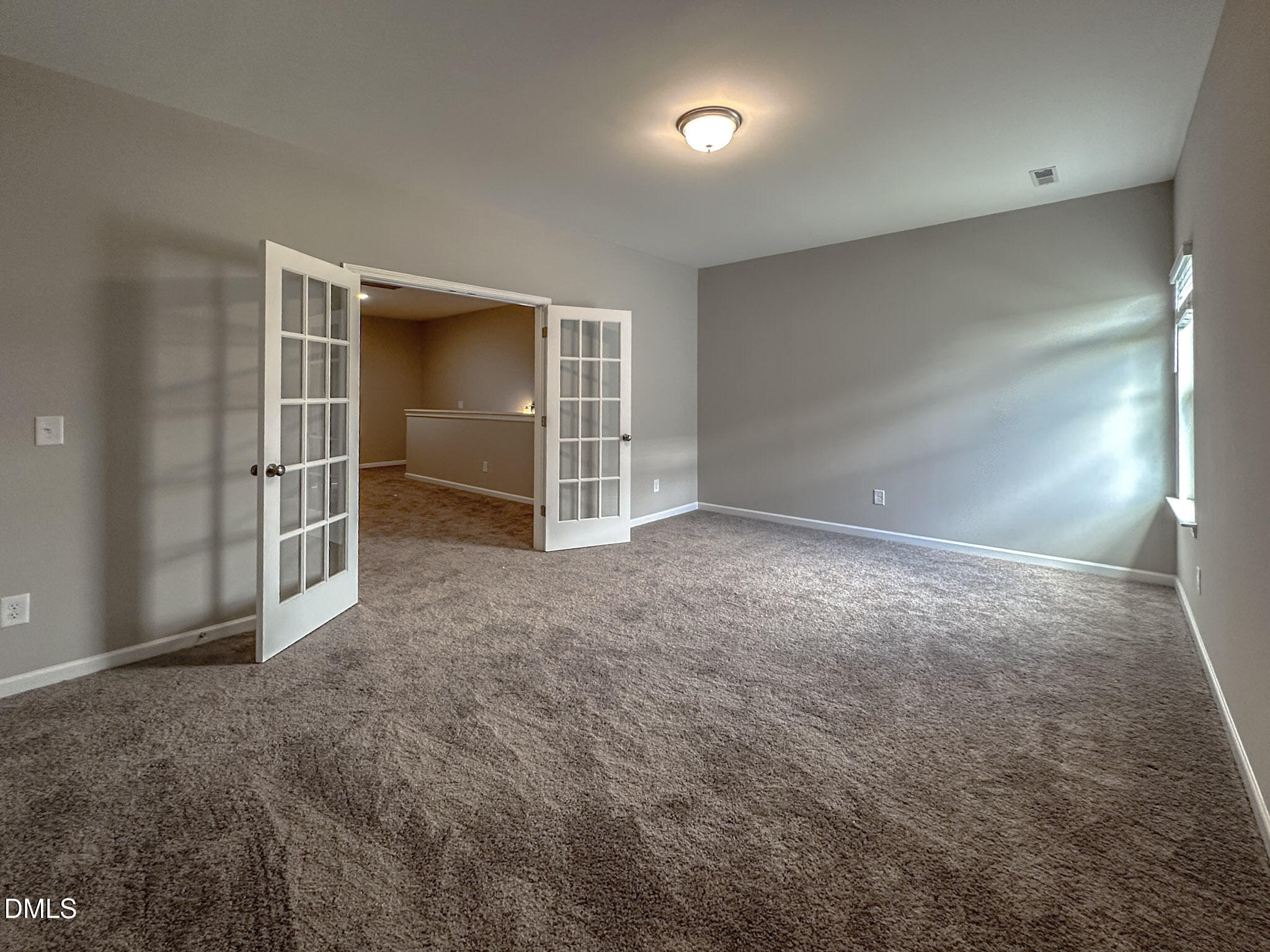 349 Spirit Spgs Road Smithfield, NC 27577 - Photo 19 of 23 an empty room with a empty space and window