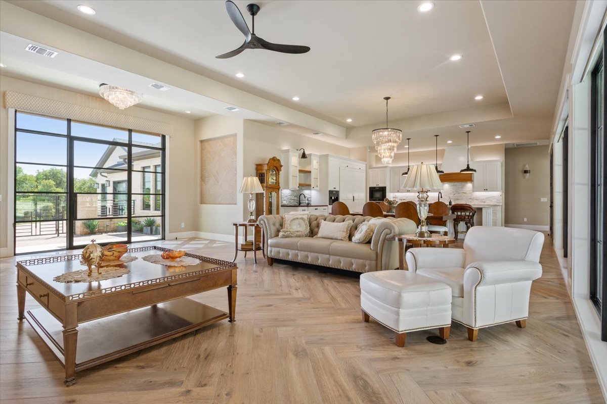 309 Highland Spring Lane Georgetown, TX 78633 - Photo 6 of 40 A view of the great room from the rear of the home showing the magnificent foyer, dining area, and kitchen...