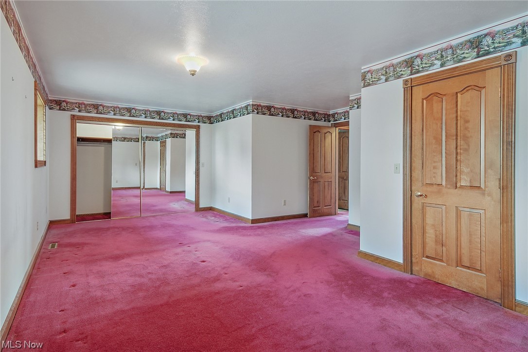 2753 Tabor Ridge Road Northeast Mineral City, OH 44656 - Photo 32 of 41 Carpeted spare room with crown molding