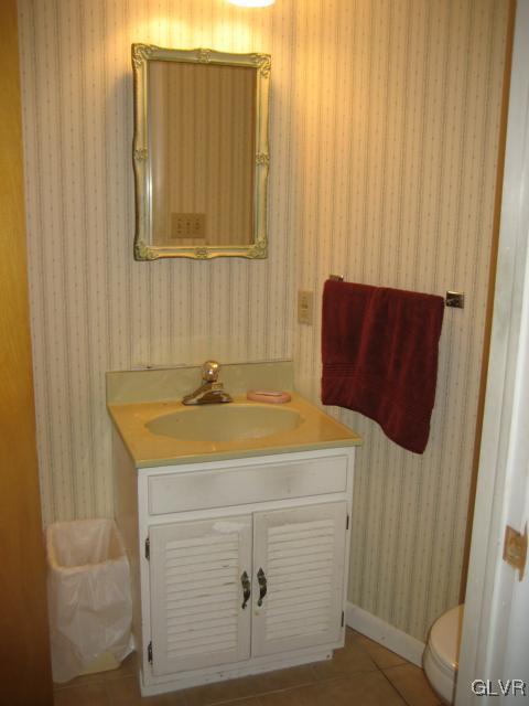6 Ridgewood Road Easton, PA 18045 - Photo 18 of 20 a bathroom with a sink and a mirror