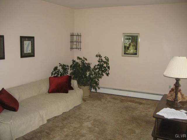 6 Ridgewood Road Easton, PA 18045 - Photo 5 of 20 a room with a bed and a potted plant