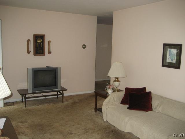 6 Ridgewood Road Easton, PA 18045 - Photo 6 of 20 a living room with a couch and a flat screen tv