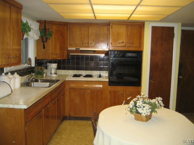 6 Ridgewood Road Easton, PA 18045 - Photo 9 of 20 a kitchen with a sink and cabinets