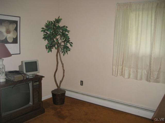 6 Ridgewood Road Easton, PA 18045 - Photo 10 of 20 a room with water heater and wooden walls